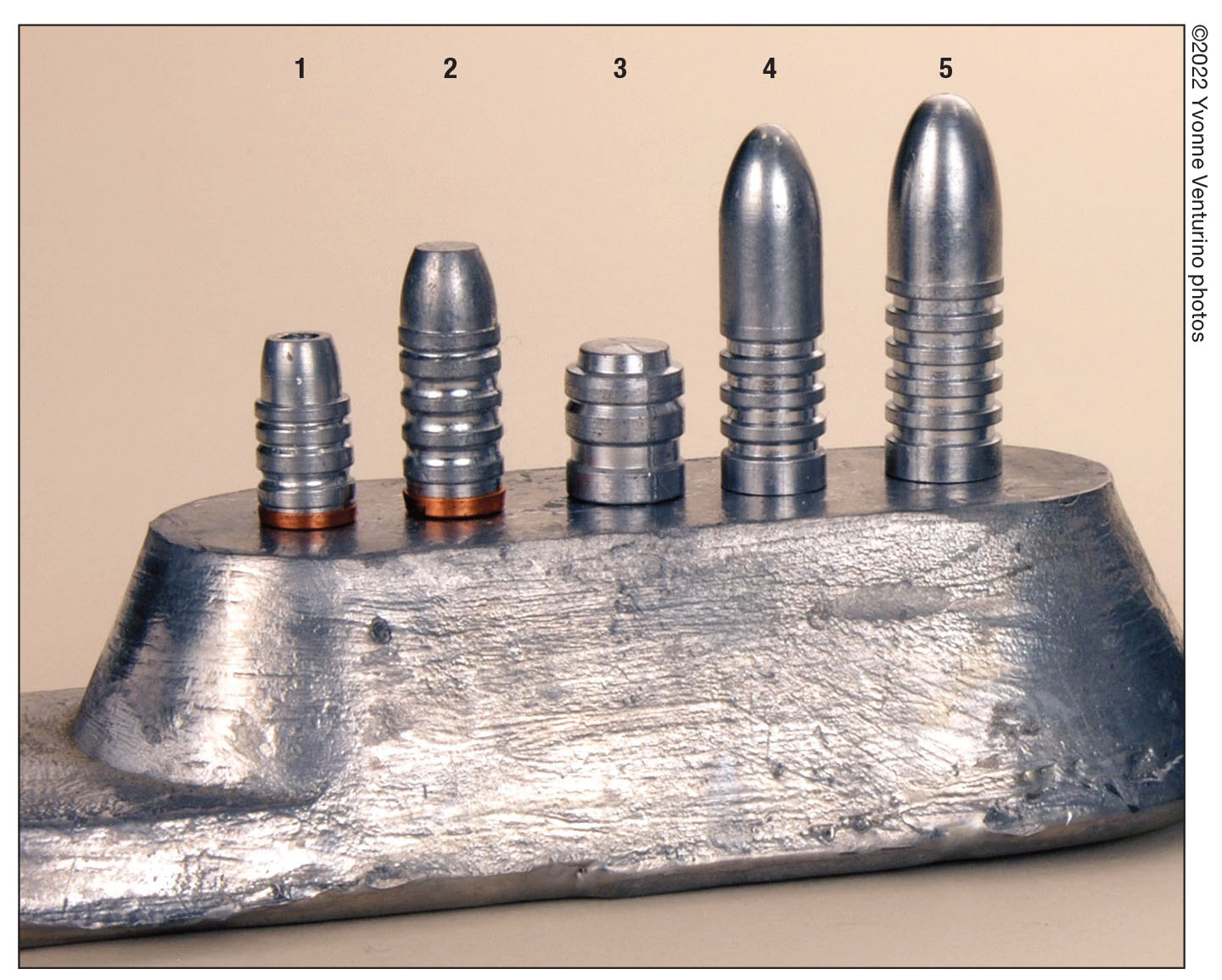 For bullets from 1,000 fps to 1,500 fps, Mike prefers a gas-check design when using 1:20 (tin to lead) alloy: (1) Lyman No. 357156HP, (2) RCBS No. 38-255-FN for .38/.357 revolvers and .38-55 rifles. The middle  wadcutter bullet (3) is a Redding/SAECO No. 453 for .45 revolvers. Bullets (4) .40- and (5) .45-caliber are Creedmoor-style from a Steve Brooks custom BPCR mould.